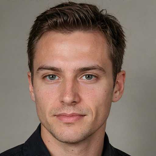 The image is a close-up portrait of a young man with fair skin and light eyes, wearing a dark shirt. He has short, neatly styled brown hair and a subtle smile. The background is a plain, muted gray. The portrait utilizes a realistic photographic style, focusing solely on the subject's face and upper body.