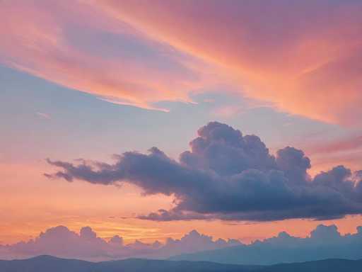 A breathtaking sunset scene unfolds over a serene landscape. The sky is a canvas of vibrant colors, transitioning from deep blue to warm orange hues. Wispy clouds are scattered across the sky, their edges tinged with orange from the setting sun. In the foreground, a series of rolling hills or mountains are silhouetted against the colorful sky, adding depth and dimension to the image. The interplay of light and shadow creates a tranquil and picturesque moment, capturing the beauty of nature as day transitions into night.