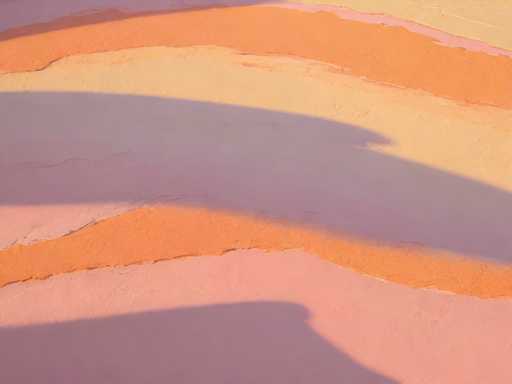The image shows an abstract painting with a gradient background transitioning from pink at the top to orange at the bottom. The painting is done on a canvas and features a rough texture that adds depth and dimension to the piece.