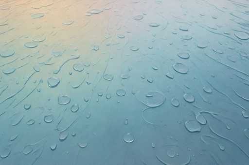 This image captures a close-up view of a rain-covered surface, likely a windshield or a piece of glass. The surface is adorned with numerous water droplets of varying sizes, creating a mesmerizing pattern. The background exhibits a gradient of colors, transitioning from a light blue at the bottom to a more vibrant mix of yellow and orange hues towards the top. The water droplets, which are clear and round, are scattered across the entire surface, with some larger droplets dominating the center and smaller ones dispersed around the edges. The overall effect is a striking contrast between the transparent water droplets and the colorful, reflective background, giving the image a dynamic and almost abstract quality.