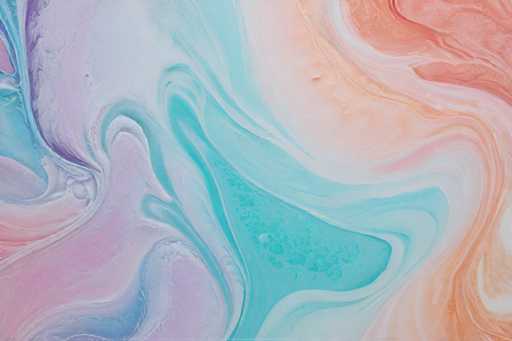 The image shows an abstract painting with a gradient background transitioning from pink and blue hues at the top left corner to orange and white at the bottom right corner. The colors used are predominantly blue, pink, and orange, creating a visually striking effect.